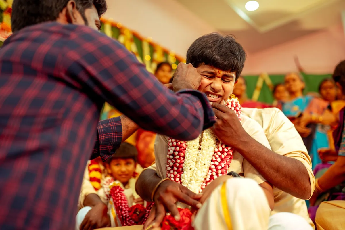 A child held close during a family ceremony