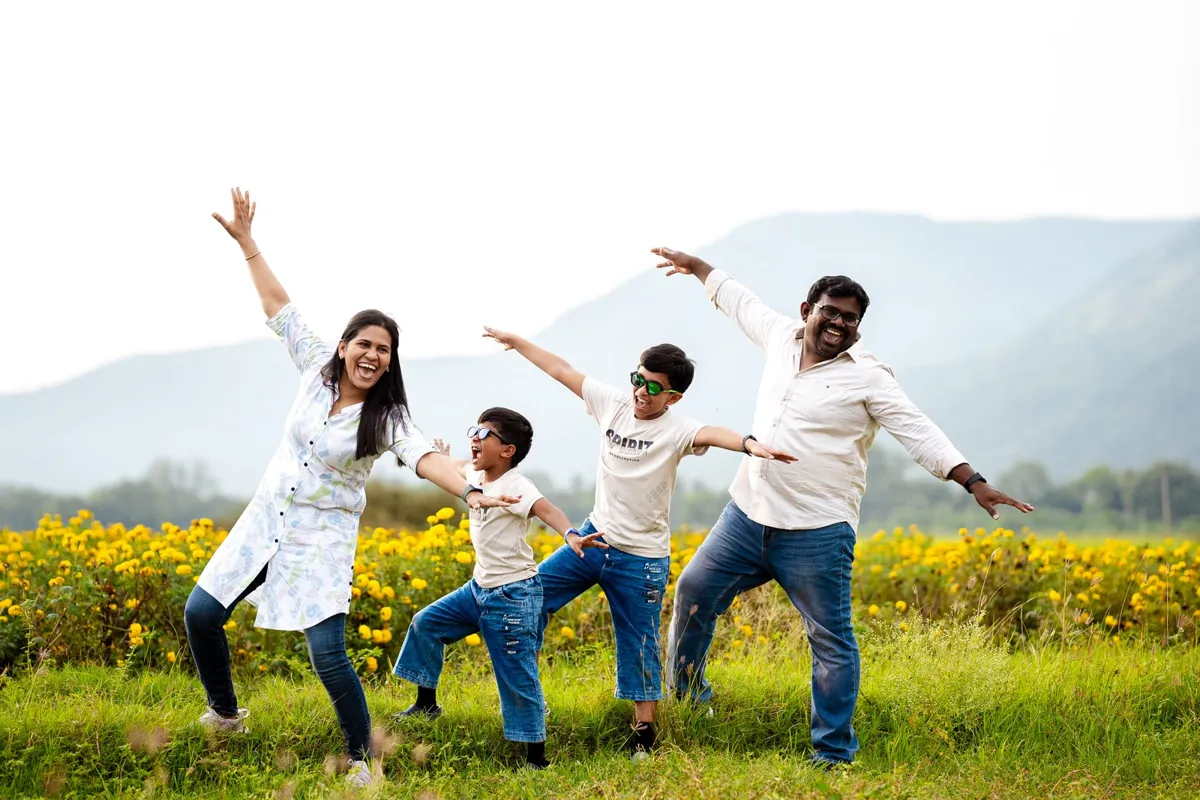 Family playing together in an open field